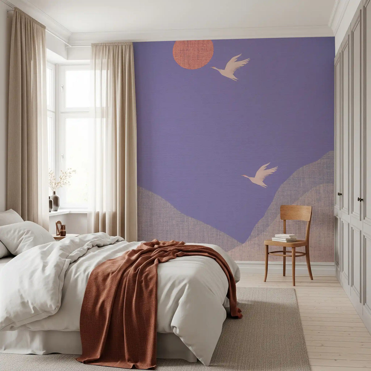 Bedroom with white bedding, rust throw and wooden chair on lavender crane wall mural GD13324