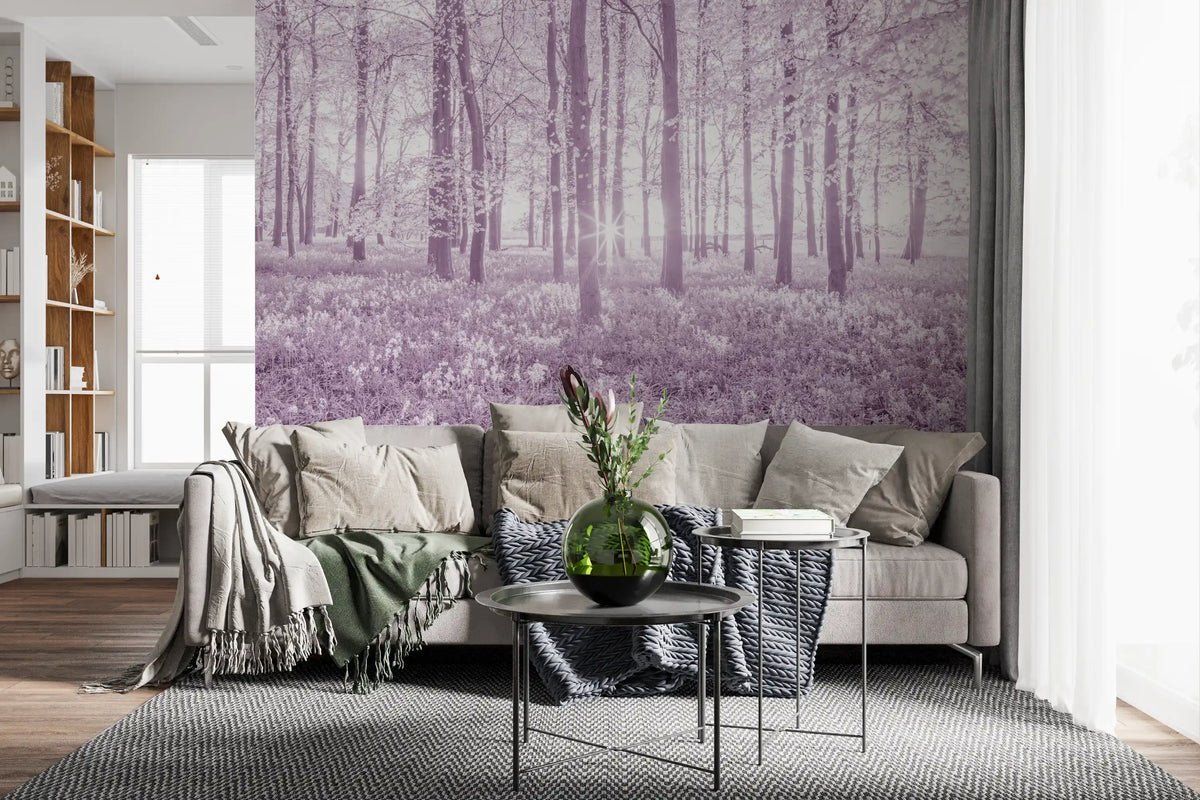 Lilac forest wallpaper behind a beige sofa with a knit throw and round glass side table GD13391