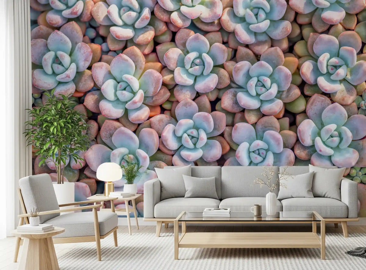 Succulent wallpaper behind light grey sofa, wooden coffee table and armchair GD13398