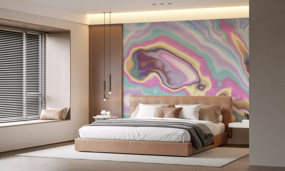 Marble wallpaper in pastel pink and mint behind a tan upholstered bed and window seat GD13431