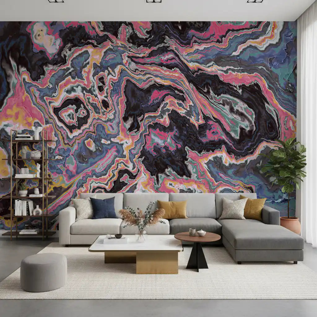 Abstract wallpaper behind a gray sectional sofa, white coffee table and round side table GD13440