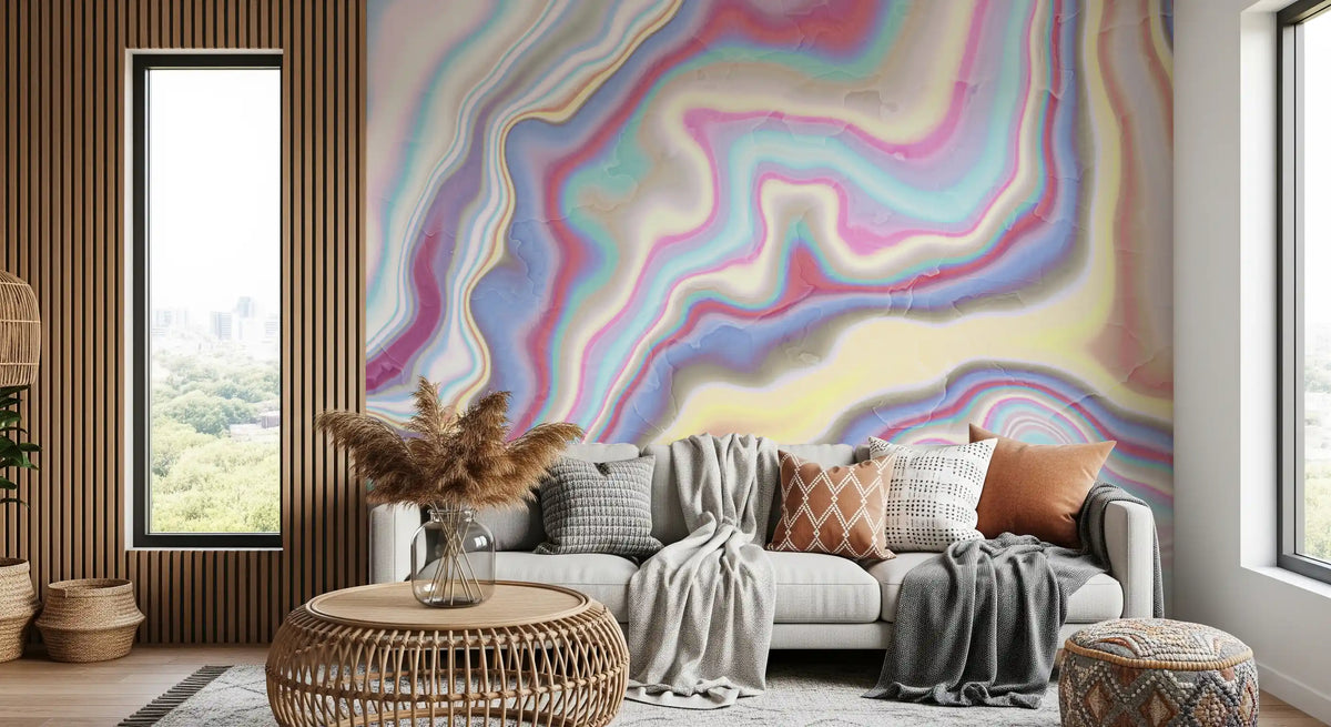 Abstract wallpaper behind a cream sofa, rattan side table and pampas grass by a slatted wall GD13442