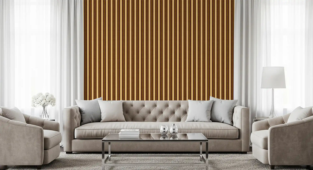 Tufted grey sofa, glass coffee table and armchairs against mustard striped wallpaper GD13508