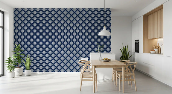 Geometric wallpaper in navy and white beside a white kitchen and wooden dining table GD13588