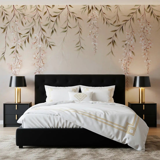 Botanical wallpaper mural behind a black tufted bed with white linen and brass lamps GD13672