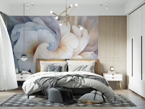 Watercolor wallpaper mural behind a bed with gray bedding and a gold chandelier GD13678