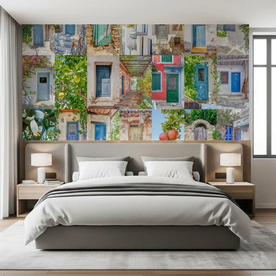 Architectural wallpaper collage behind a gray upholstered bed with bedside lamps GD13687