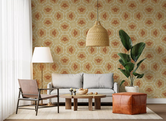 Floral wallpaper behind a white sofa, leather sling chair and cognac pouf GD13688