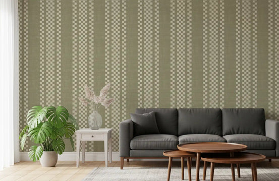 Sage green wallpaper with cream checker stripes behind charcoal sofa and walnut tables GD13840