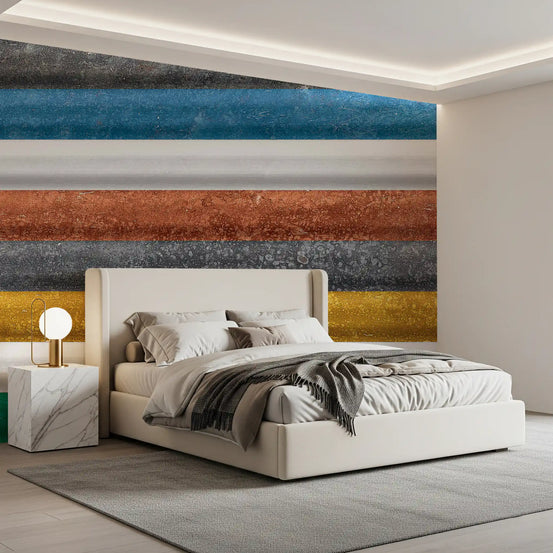 Multicolor stripe geometric wallpaper behind a white upholstered bed and marble nightstand GD13917