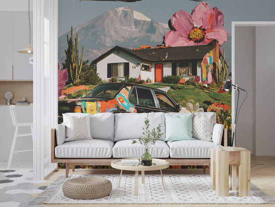 Floral wallpaper mural behind a white sofa, jute pouf and wooden side table GD13945