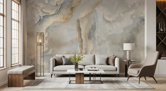 Living room with gray loveseat, taupe armchair and wood bench on cream onyx marble wallpaper GD13985