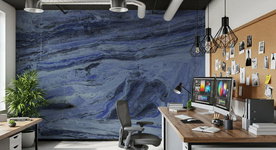 Marble wallpaper in a home office with twin monitors, a wood desk, a cork board and black pendants GD13995