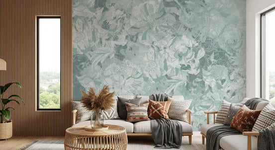 Sage floral wallpaper behind beige sofas with striped cushions and pampas grass GD14003
