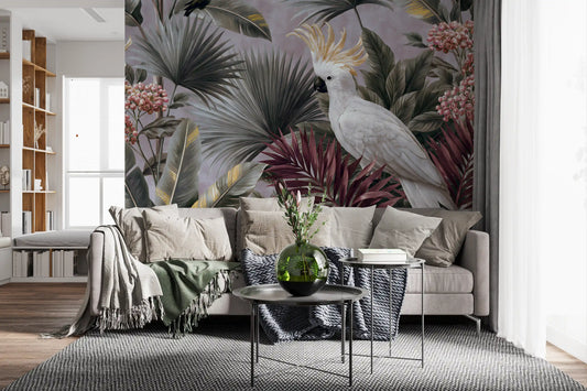 Cockatoo and palm leaf mural behind a gray sofa with knit throws and a green glass vase GD14017