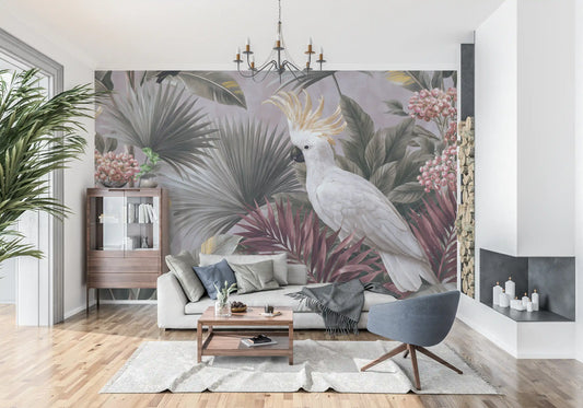 Tropical wallpaper mural with a white cockatoo behind a gray sofa and fireplace GD14017