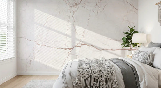 Bedroom corner with macrame throw and slatted sunlight on blush veined marble wall GD14071