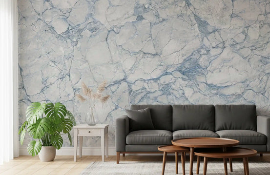Azure marble wallpaper behind a charcoal sofa with nested wood coffee tables GD14097