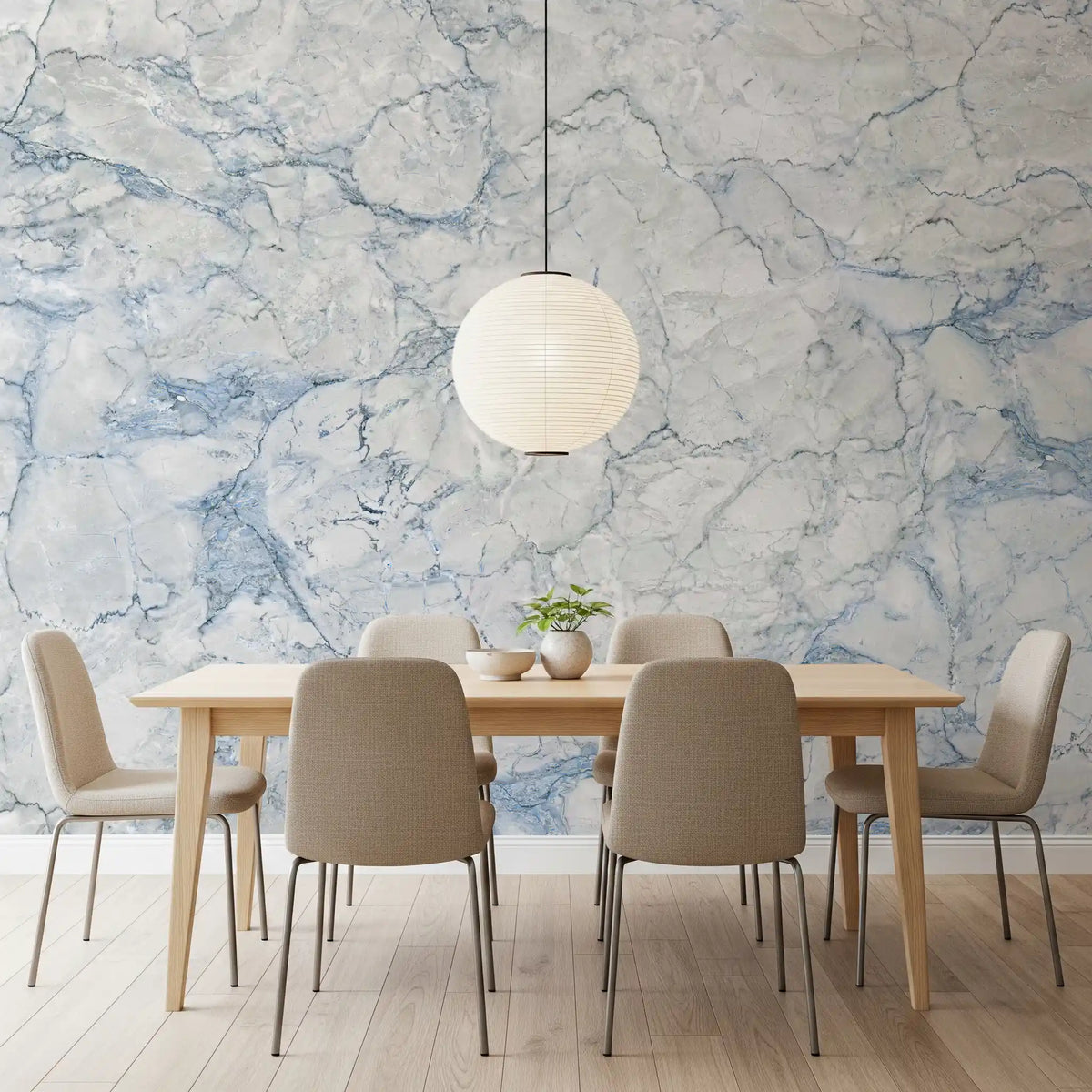 Dining room with wood table, taupe chairs and paper globe pendant on blue marble wallpaper GD14099