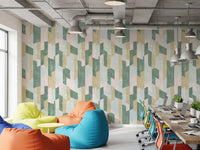 Office with colorful bean bags and long desk against pastel painted block wall GD14169