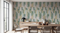 Round wood dining table and beige chairs against sage and blush geometric wallpaper GD14169