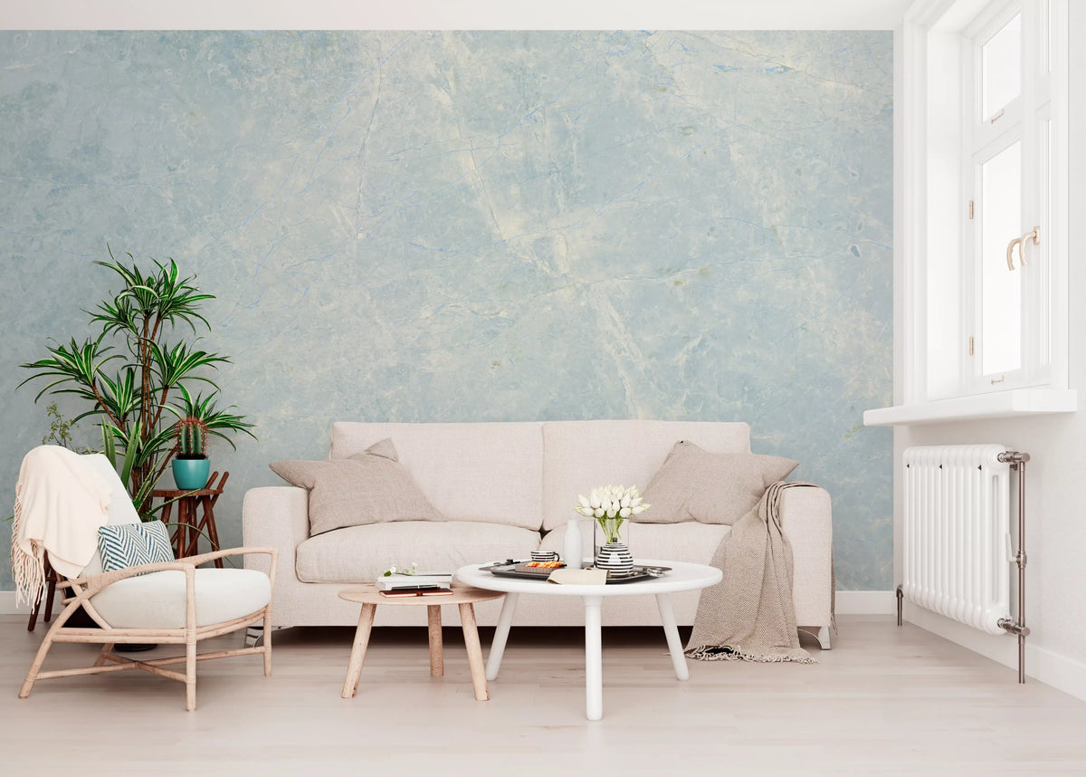 Cream sofa, round white coffee tables and wood armchair under blue marble wallpaper GD14187
