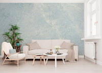 Cream sofa, round white coffee tables and wood armchair under blue marble wallpaper GD14187