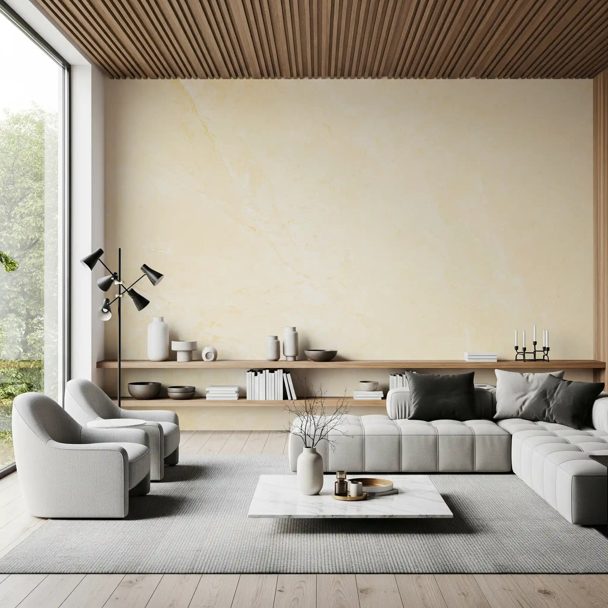 Gray sectional sofa and floating oak shelf under a wood ceiling with a cream marble wall GD14189