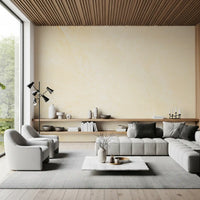 Gray sectional sofa and floating oak shelf under a wood ceiling with a cream marble wall GD14189