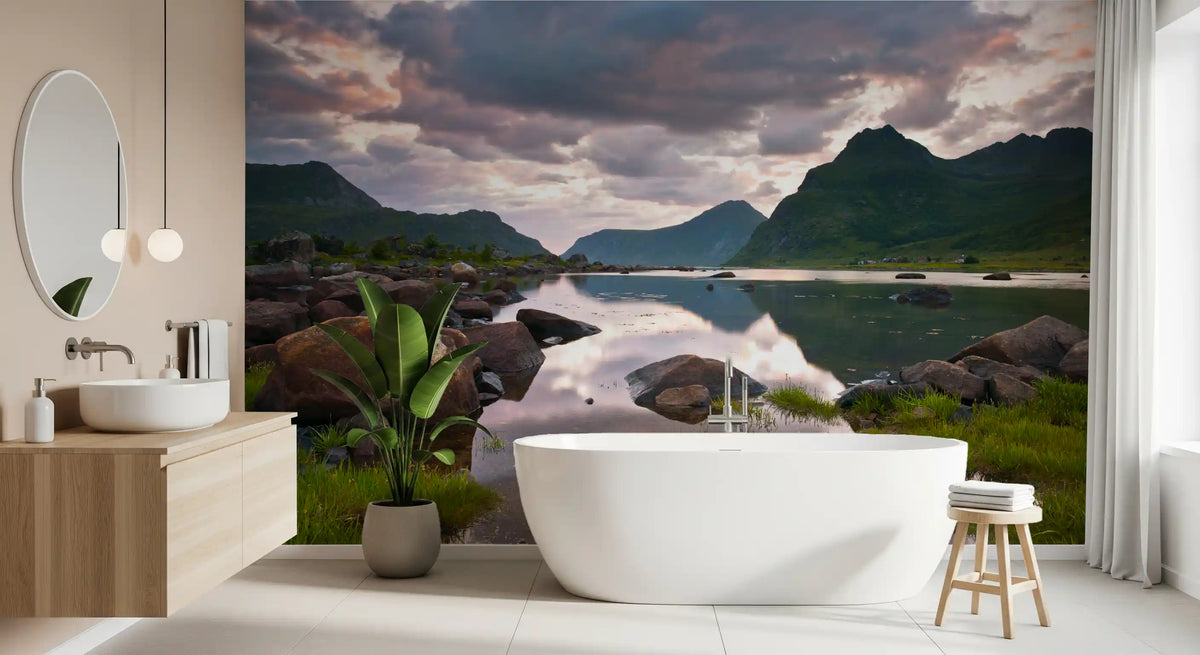 Mountain wallpaper beside oval mirror, white tub and potted plant in bathroom GD14192