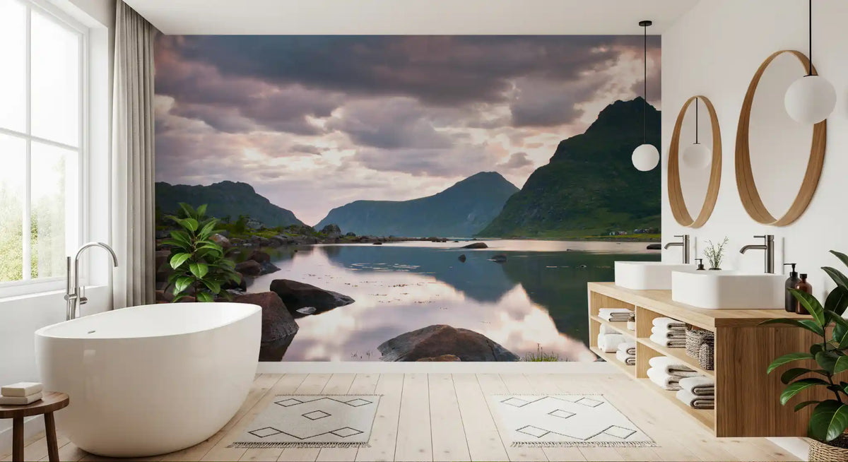 Mountain wallpaper mural behind white freestanding tub and wood vanity in bathroom GD14192