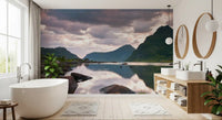 Mountain wallpaper mural behind white freestanding tub and wood vanity in bathroom GD14192