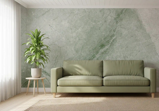 Sage marble wallpaper behind an olive green sofa and potted plant in a living room GD14199
