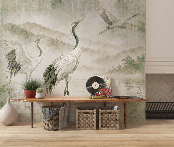 Crane wallpaper behind a wood console with wicker baskets and a record player GD14201