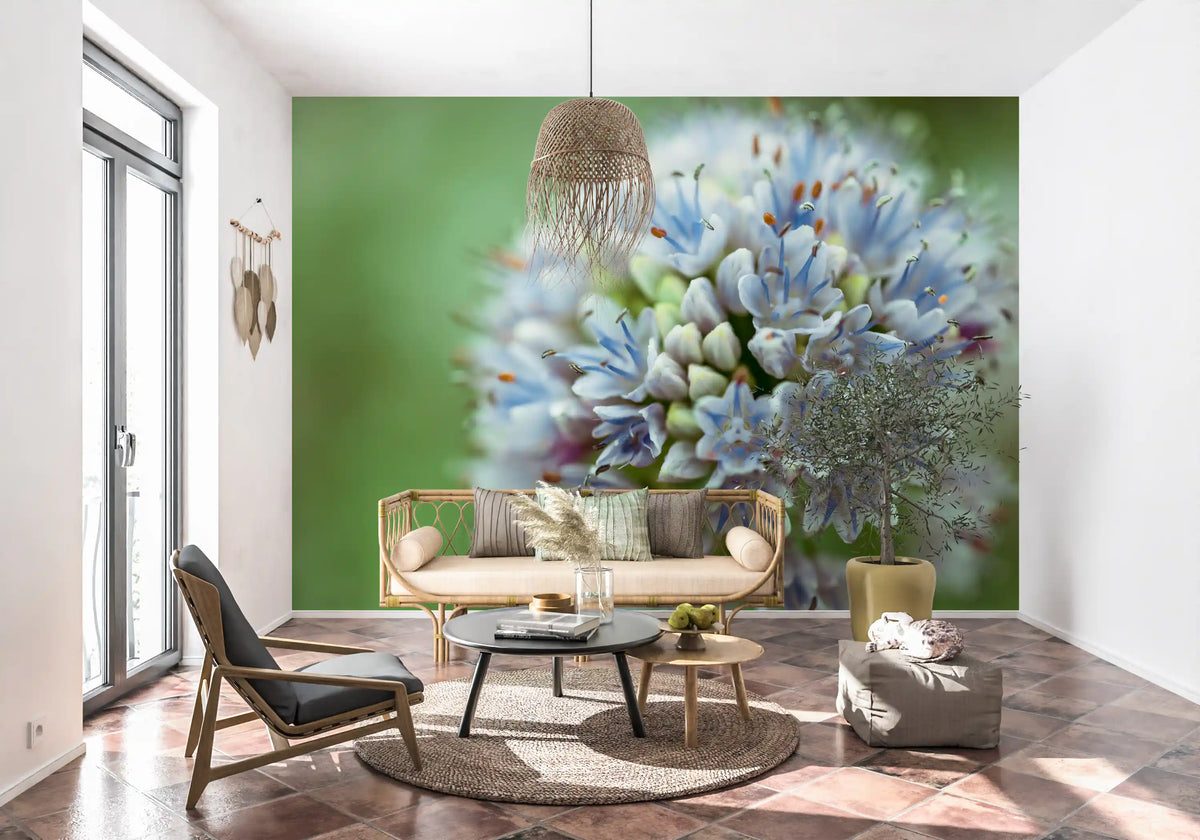 Rattan loveseat and macrame pendant on terracotta tiles in front of an allium mural GD14202