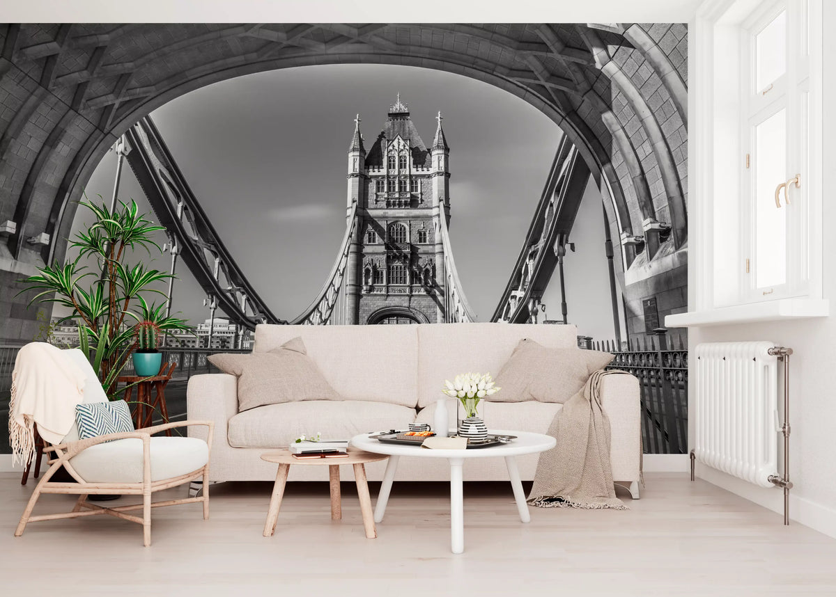 London wallpaper behind a cream sofa, rattan armchair and round white tables GD14209