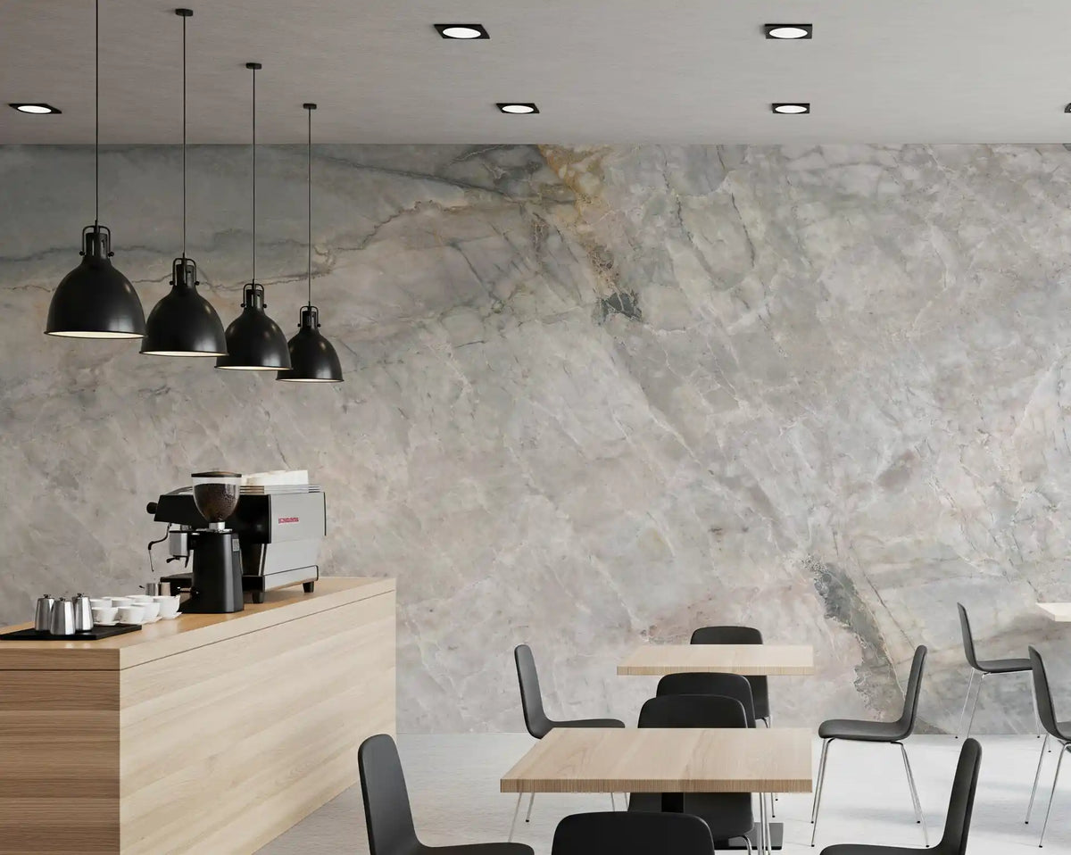 Marble wallpaper behind a cafe counter with coffee machine, oak tables and black pendants GD14211