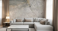 Gray marble mural behind a light gray sectional sofa and a white marble coffee table GD14211