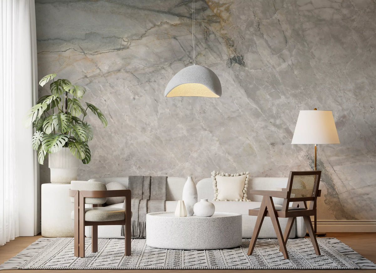 Natural stone mural in a living room with white sofa, cane chairs and round table GD14211