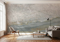 Gray stone mural in a bright living room with a lounge chair and small sofa GD14215
