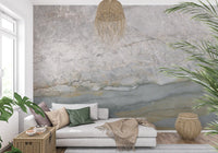 Blue gray marble mural behind a white daybed with green cushions and palm plants GD14215