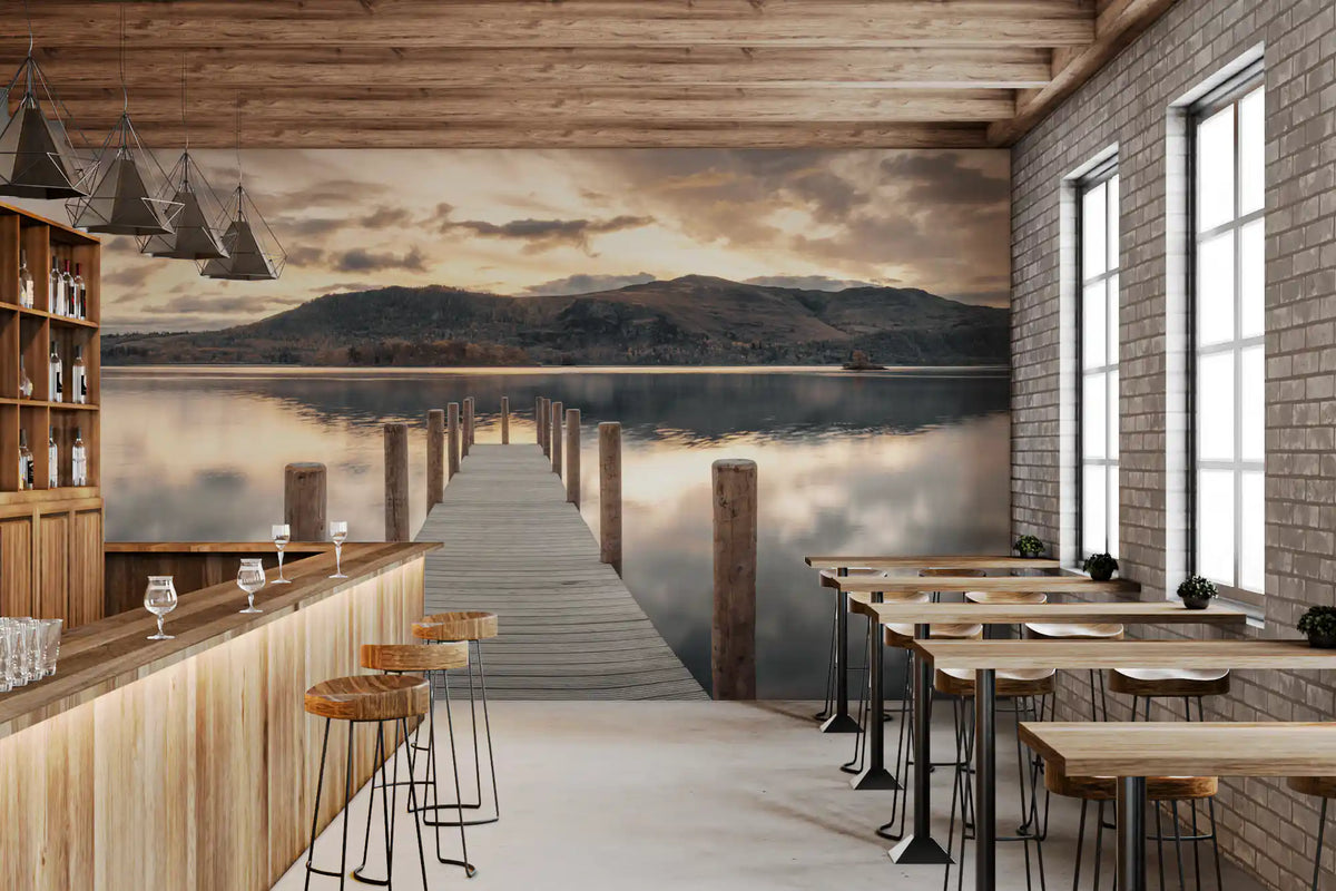 Bar with wooden counter, high stools and brick wall beside lake wallpaper of a jetty at dusk GD14220