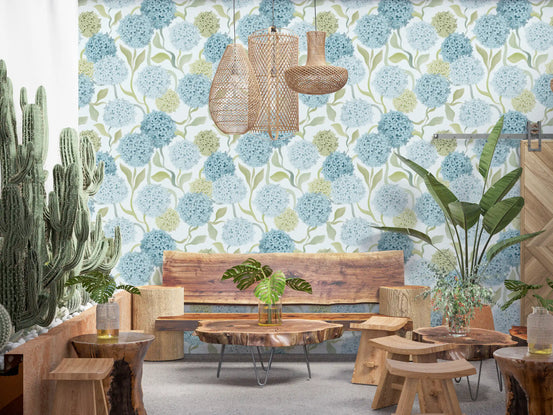 Pastel hydrangea garden wallpaper behind a rustic wood table with cacti and rattan pendants GD12711