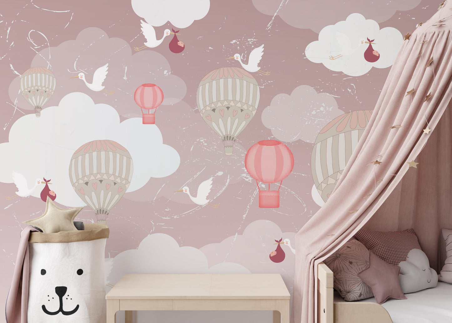 3D Hot Air Balloon wallpaper mural in pink with balloons beside a wood bed with mauve pillows and a pink canopy