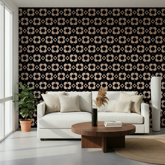60s Charm wallpaper of retro daisies on black behind a cream sofa and pampas in a bright living room