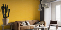 Bold yellow wall mural with textured details

