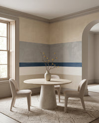 Quiet horizontal stripes guide a Living  room around the Agnes Balance wall mural.