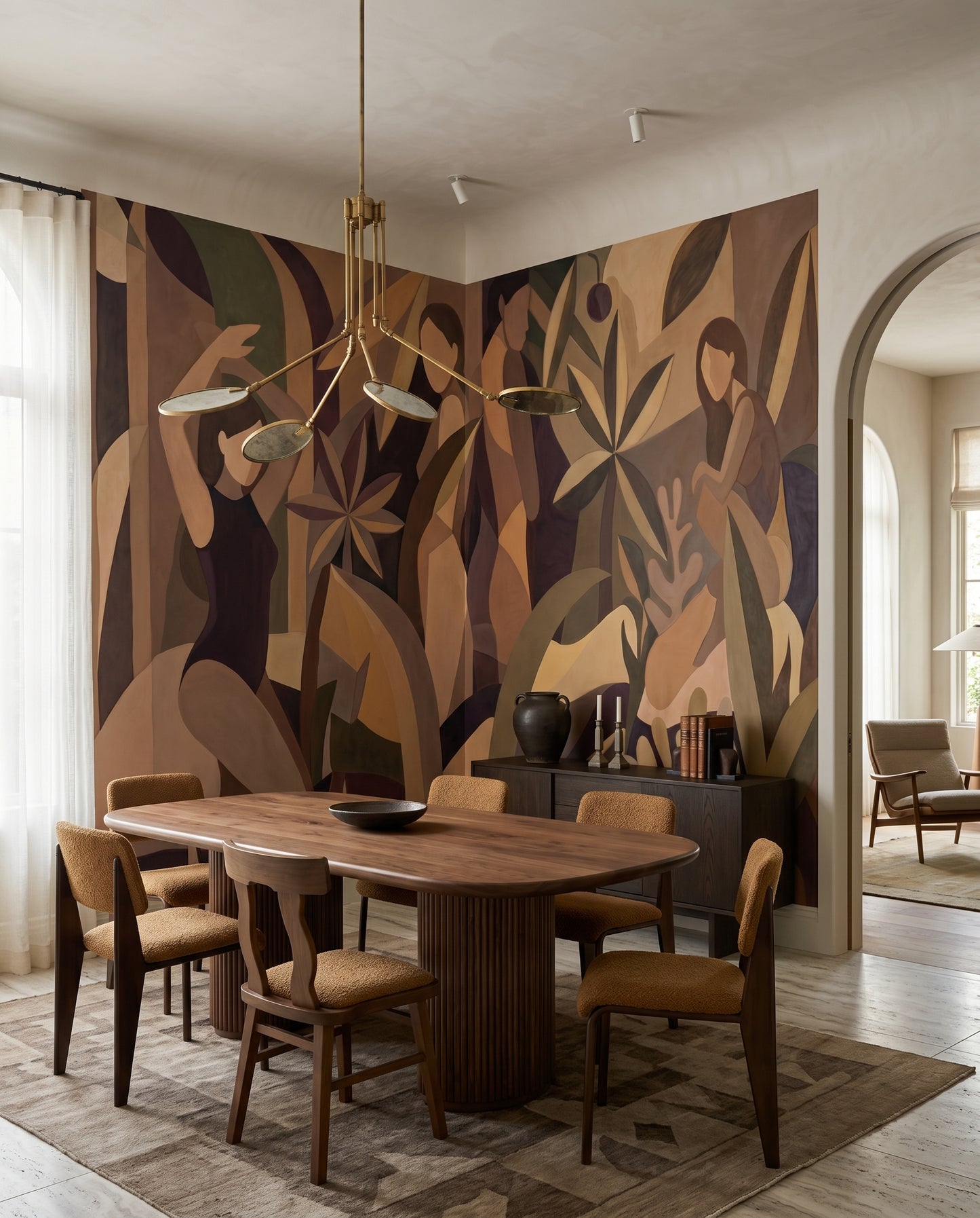 Painted female forms drift between leaves on the wall mural in a Dining room