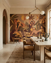 Dining room  sits beside a folk botanical Amber Flora wall mural full of earthy shades.