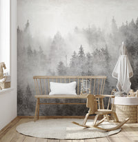 Foggy forest wallpaper in grayscale tones
